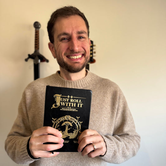 A guy holding a journal book